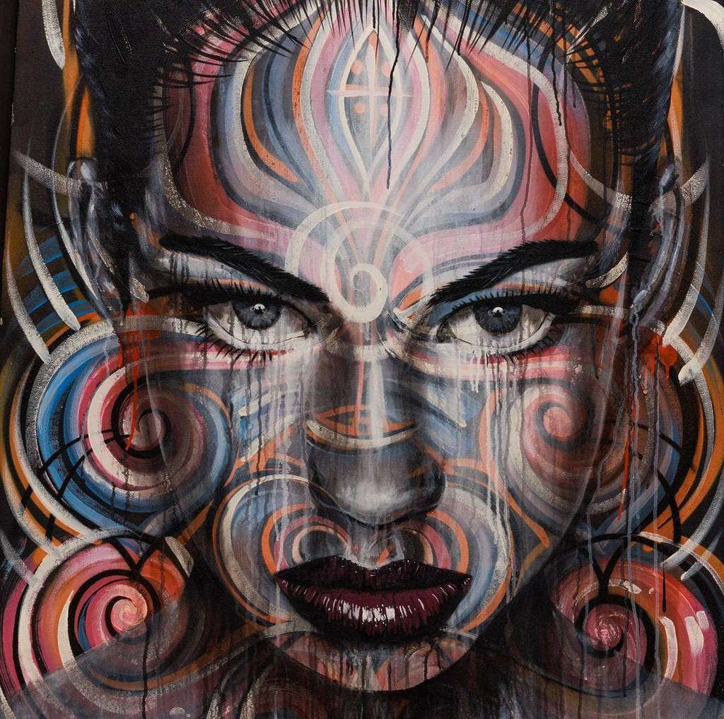 street art of a woman's face by Rone and Phibs, which will be on display in The Outsiders Melbourne exhibition
