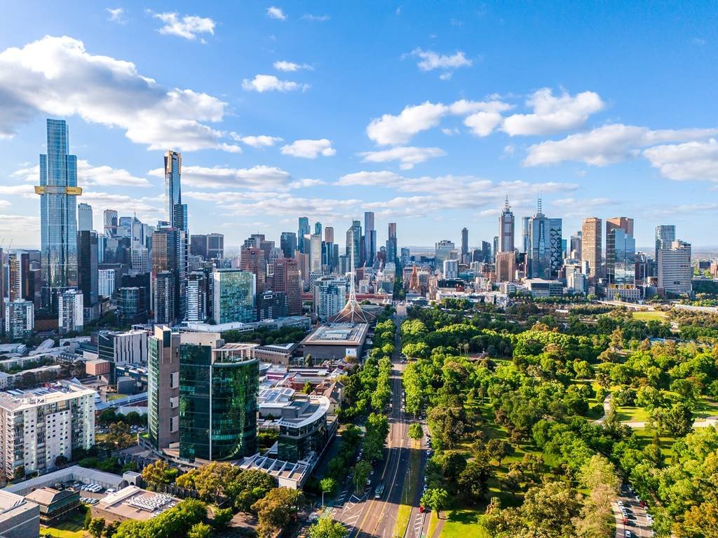 A panoramic view of Melbourne city and skyline on a sunny afternoon, taken from a drone. Exploring the city is one of the very best things to do in Melbourne on a weekend.